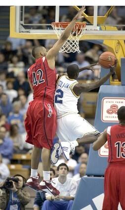 UCLA point guard Darren Collison draws a foul from Arizona forward Jamelle Horne during the first half Thursday night.