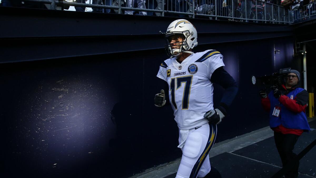 Philip Rivers takes the field in the AFC Divisional playoff game against the New England Patriots at Gillette Stadium.
