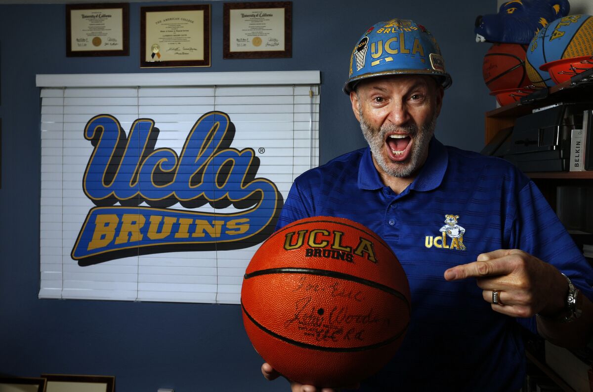 Larry "Frisbee" Davis, who as a student created an iconic UCLA sports cheer 40 years ago, is seen at his home in Porter Ranch. Davis doesn't care for the way the cheer is performed nowadays.