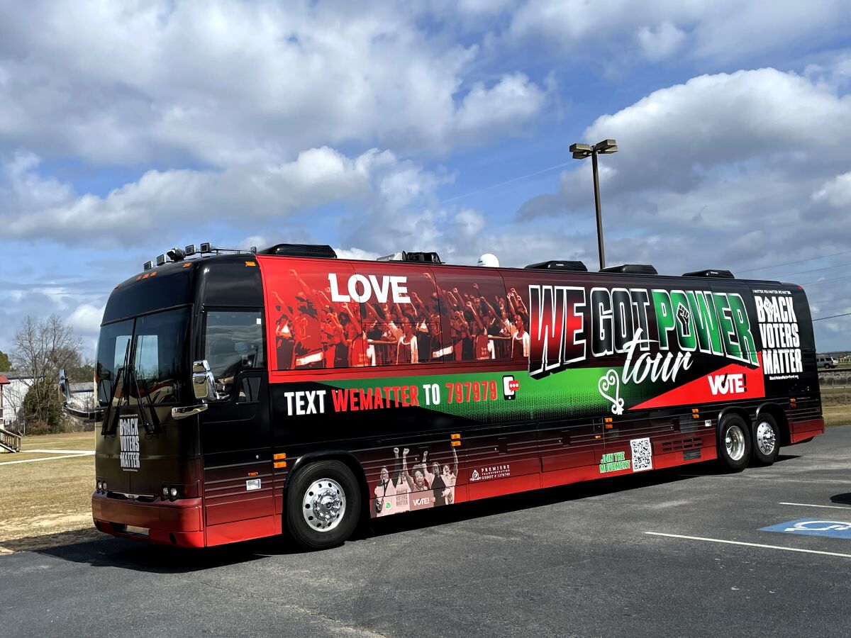 The red, black and green Black Voters Matter bus is emblazoned with "We Got Power."
