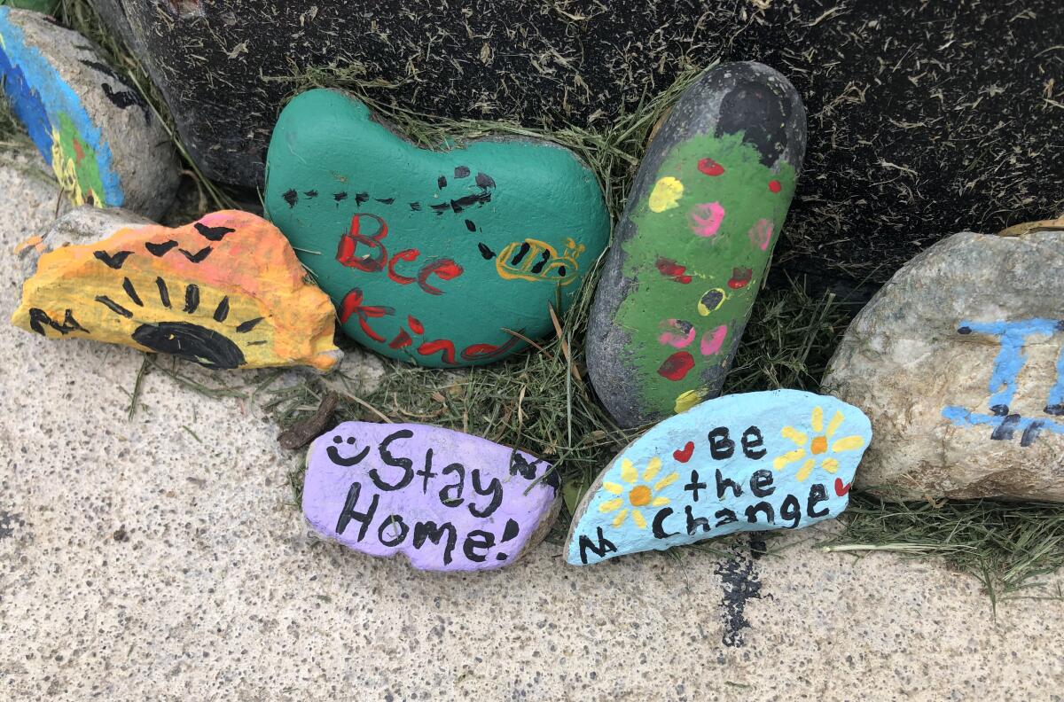 Painted rocks scattered across a Santa Clarita neighborhood offer hope and encouragement. The creators want to help people cope with coronavirus isolation.