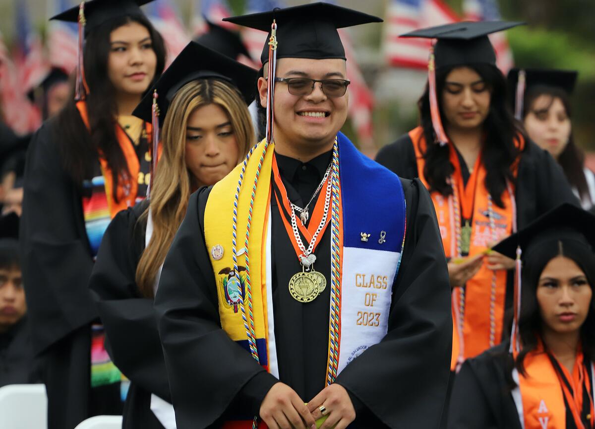 Los Amigos graduate Alexander Amaya smiles during his graduation ceremony Wednesday.