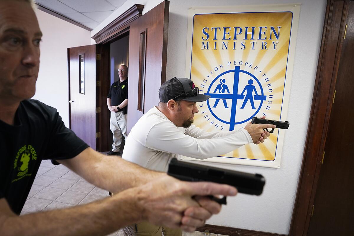 Churchgoers practice clearing a hallway during armed security training in Texas