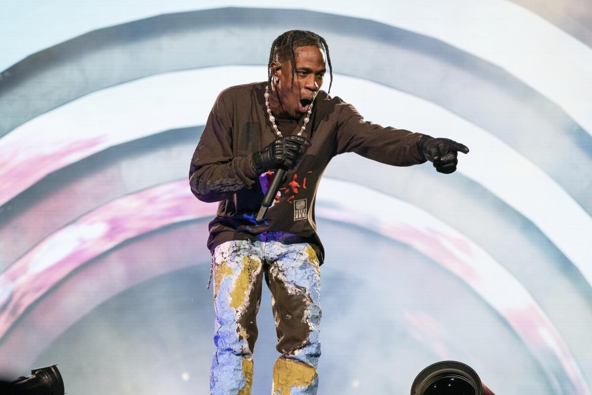 Travis Scott Was Reportedly Paid Millions By Apple To Finish His Deadly  Astroworld Concert