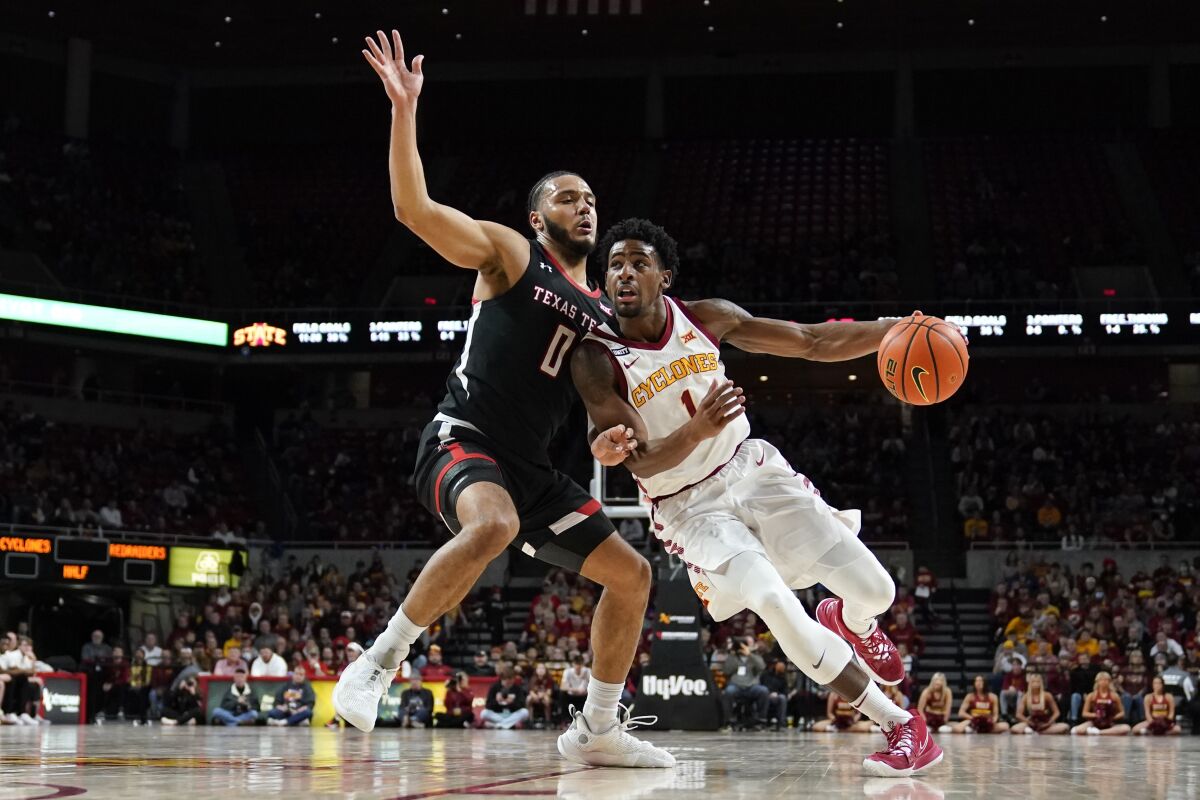 Iowa State guard Izaiah Brockington (1) drives to the basket past Texas Tech forward Kevin Obanor (0) during the first half of an NCAA college basketball game, Wednesday, Jan. 5, 2022, in Ames, Iowa. (AP Photo/Charlie Neibergall)