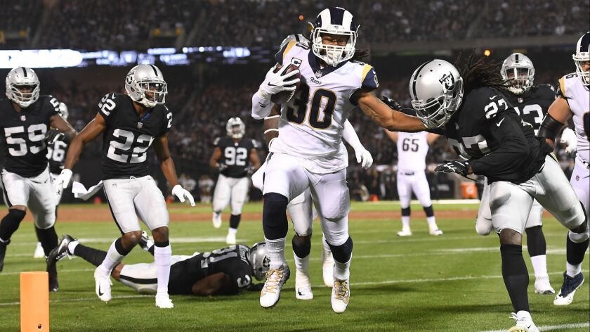 Rams running back Todd Gurley scores against the Raiders in the first quarter.