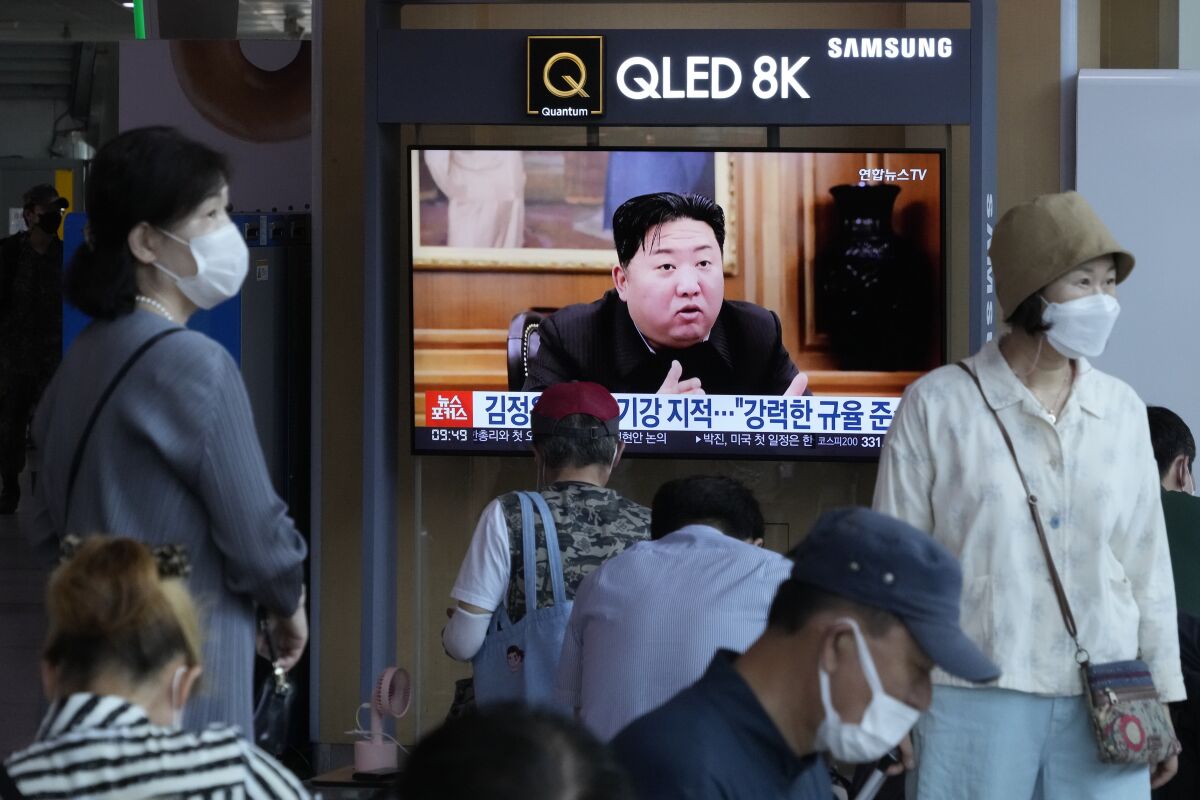 People watch a TV showing an image of North Korea leader Kim Jong Un during a news program at the Seoul Railway Station in Seoul, South Korea, Monday, June 13, 2022. Kim and his top deputies have pushed for a crackdown on officials who abuse their power and commit other "unsound and non-revolutionary acts," state media reported Monday, as Kim seeks greater internal unity to overcome a COVID-19 outbreak and economic difficulties. (AP Photo/Ahn Young-joon)