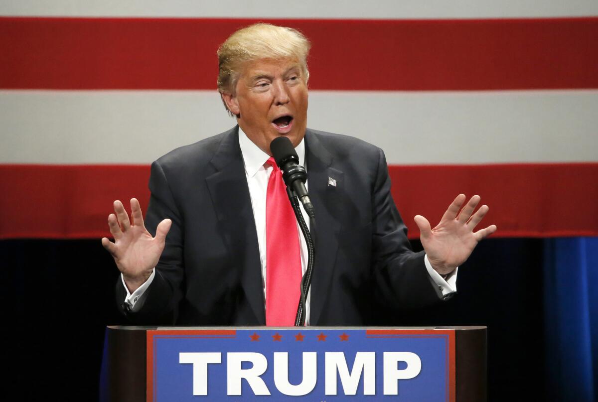 Republican presidential candidate Donald Trump addresses the crowd during a rally at the Milwaukee Theatre on Monday.