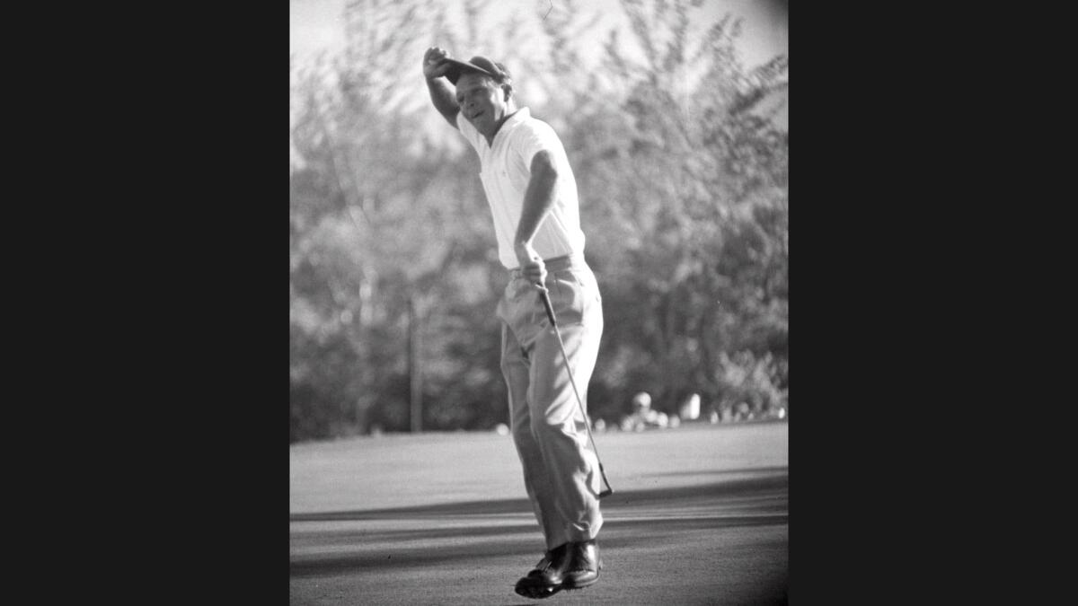 Arnold Palmer begins to celebrate after winning the 1960 U.S. Open at Cherry Hills outside of Denver.