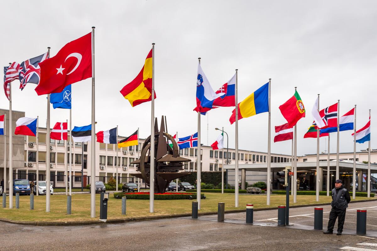 Flags of the NATO nations fly outside the alliance's headquarters in Brussels on July 28 as ambassadors of the 28 member states meet in emergency session to discuss Turkey's response to recent terrorist strikes.