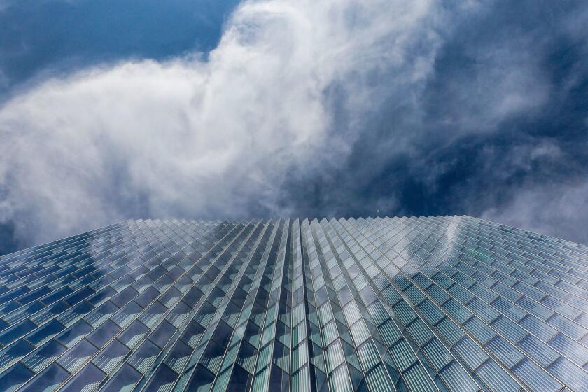 Angled windows reflect clouds passing over the new federal courthouse in downtown Los Angeles.