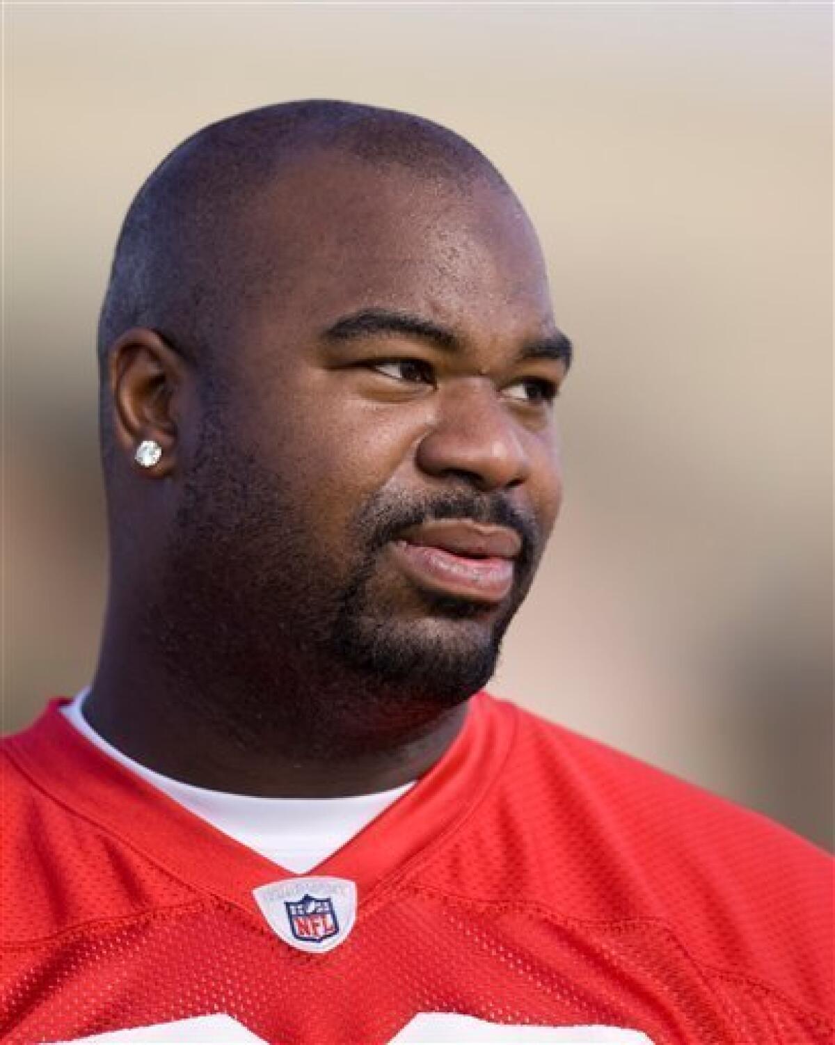 This Feb. 5, 2009 file photo shows Tennessee Titans defensive tackle Albert Haynesworth looking on during AFC Pro Bowl football practice, in Kapolei, Hawaii. Haynesworth, Tennessee's franchise player in 2008, had his best season knowing that he would be a free agent again this year. (AP Photo/Marco Garcia, File)