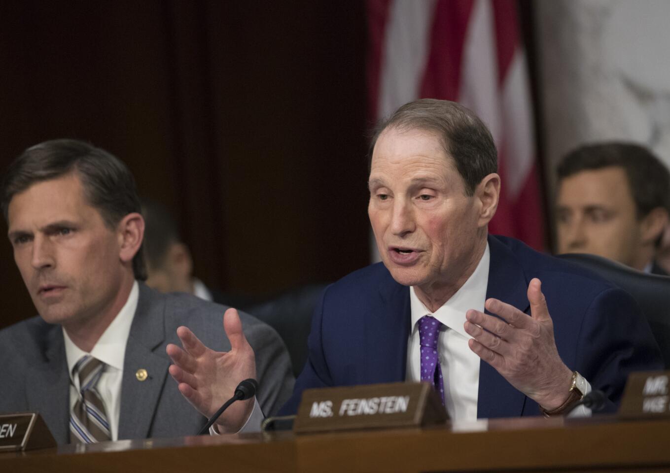 Senate Intelligence Committee member Sen. Ron Wyden, D-Ore., right, with Sen. Martin Heinrich, D-N.M., questions Attorney General Jeff Sessions on Capitol Hill in Washington, Tuesday, June 13, 2017, during the committee's hearing about his role in the firing of FBI Director James Comey and the investigation into contacts between Trump campaign associates and Russia. (AP Photo/J. Scott Applewhite)