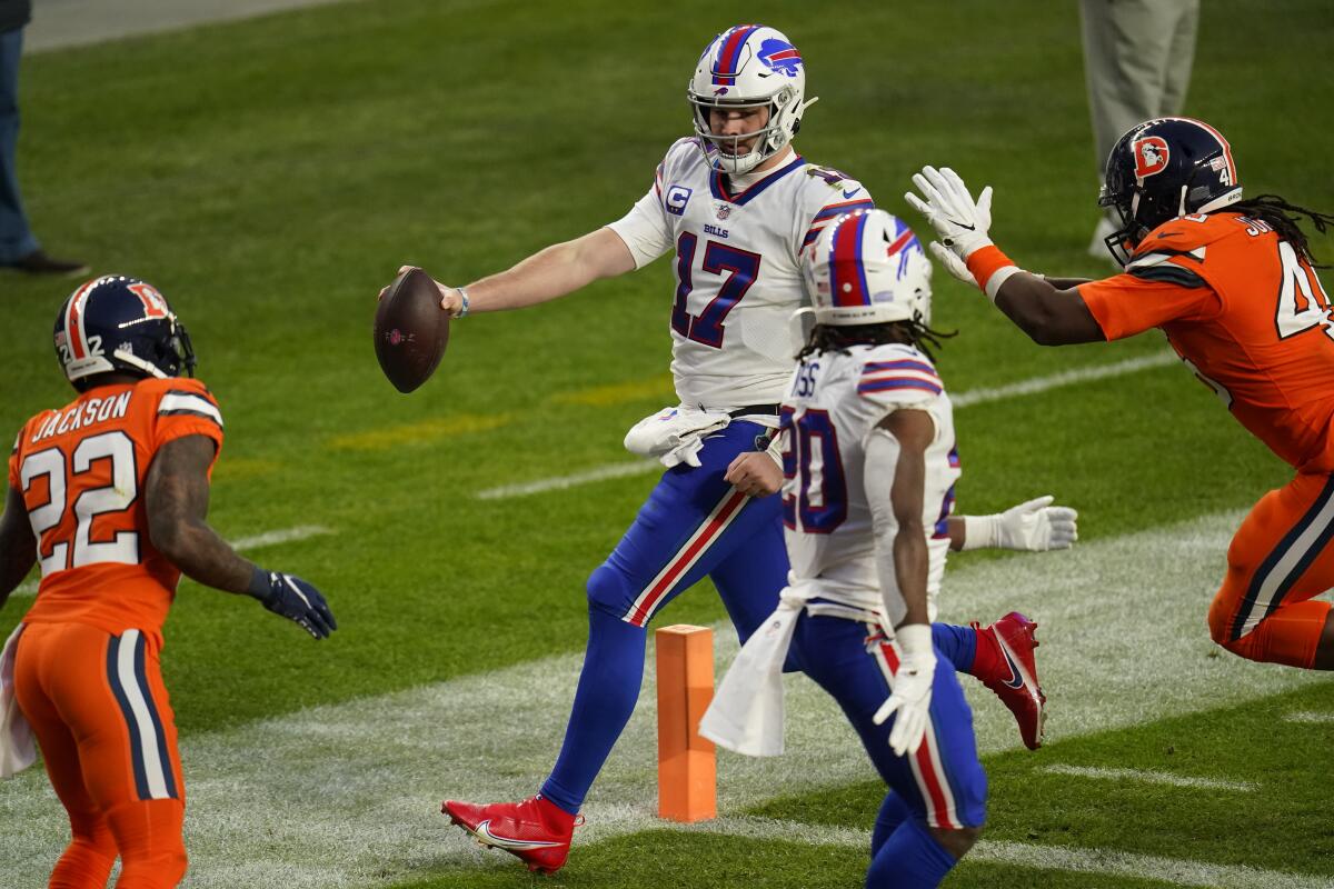 Buffalo Bills quarterback Josh Allen scores a touchdown during the second half against the Denver Broncos on Dec. 19, 2020.