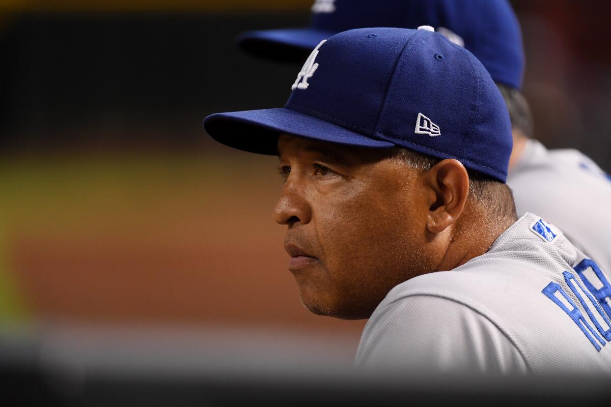 Dodgers manager Dave Roberts looks on during a game against the Arizona Diamondbacks on Aug. 30.