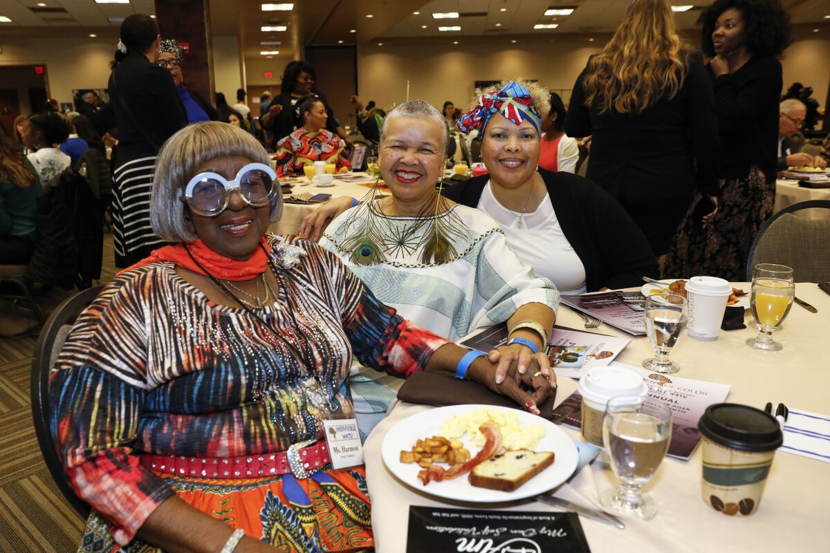 From left to right, activist Kathleen Harmon, author Starla Lewis and Marian Penick gathered to celebrate black women leaders during the 3rd Annual Women of Color ROAR breakfast Saturday at the  Jacobs Center for Neighborhood Innovation.