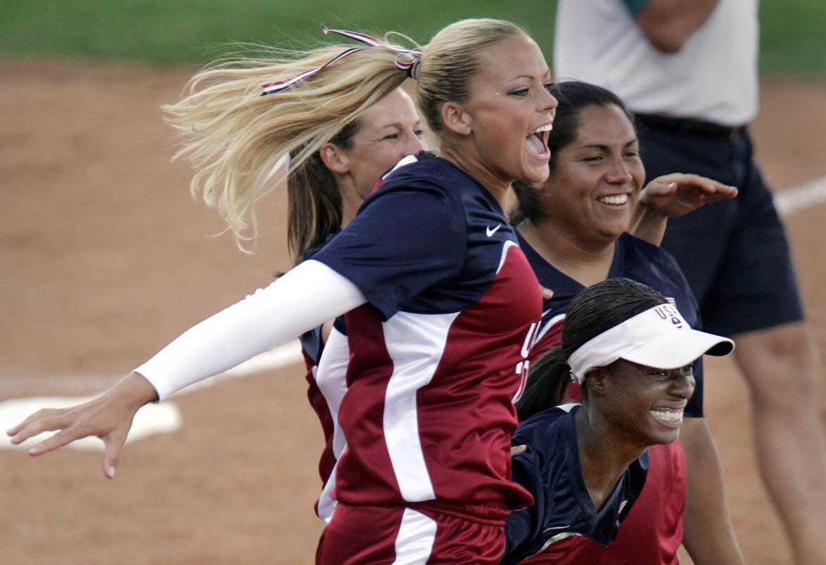 Jennie Finch and teammates take to the field to celebrate a U.S. gold medal in Athens.