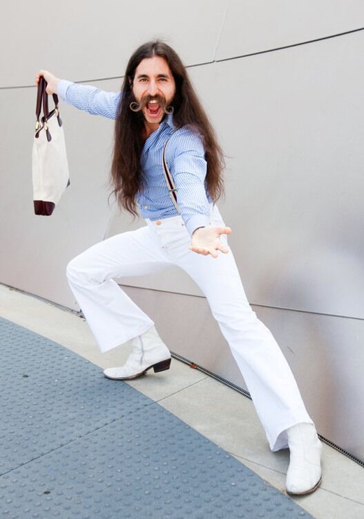 Alexander Antebi, a.k.a. Conquistador from West Los Angeles, is wearing white high-waisted bell bottoms, striped suspenders and Flamenco boots. "Edwardian Ziggy Stardust goes to Transylvania," is how Antebi describes his style.
