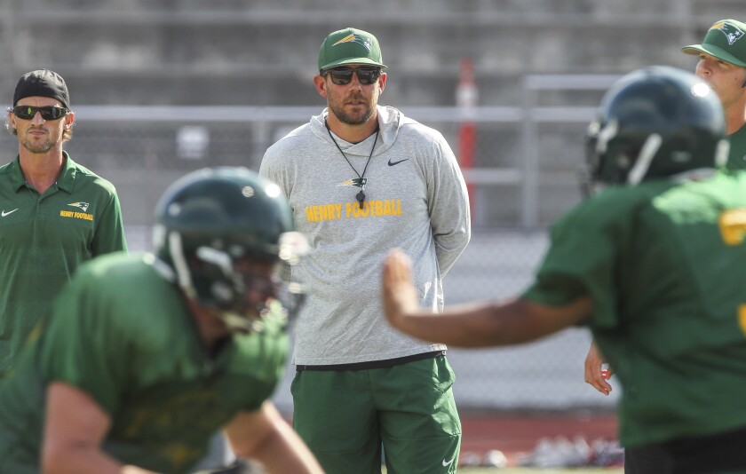 Patrick Henry coach JT O’Sullivan guides his team in practice on Tuesday.