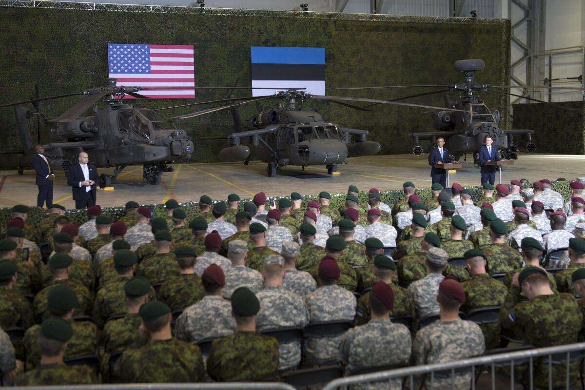 President Obama, with Estonia's Prime Minister Taavi Roivas, speaks to U.S. and Estonian military personnel at Tallinn Airport in Tallinn, Estonia, on Sept. 3.