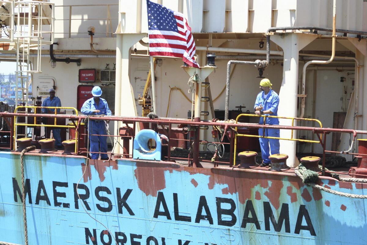 In this 2009 photo, crew members work aboard the U.S.-flagged Maersk Alabama, known for the Somali pirate hijacking that became the 2013 film "Captain Phillips." Two U.S. security contractors were found dead in the ship this week.