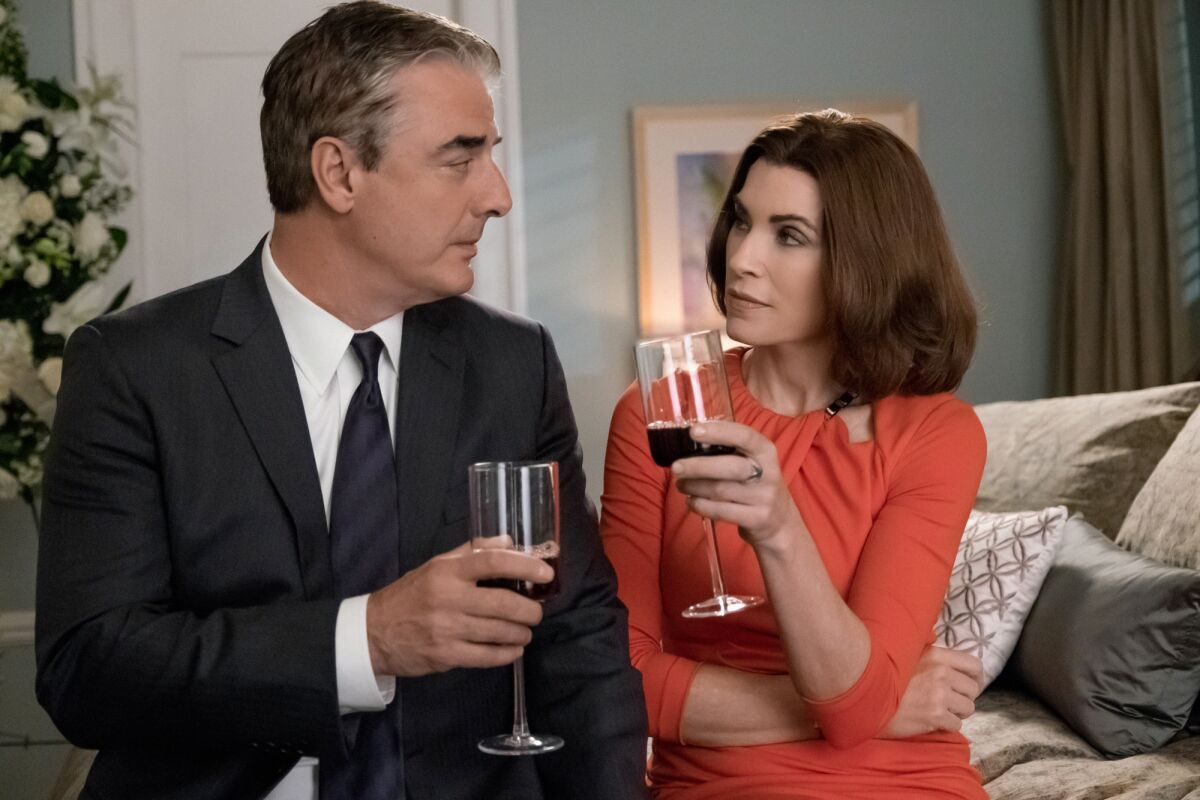 Chris Noth portrays Peter Florrick, left, and Julianna Margulies portrays Alicia Florrick in a scene from 'The Good Wife.'