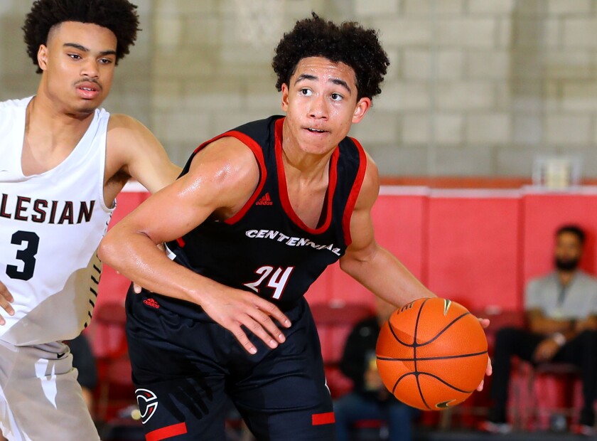 Freshman Jared McCain of Corona Centennial (right) dribbles against Salesian's Austin Johnson at Saturday's Nike Extravaganza. McCain scored 14 points in a 59-51 victory.
