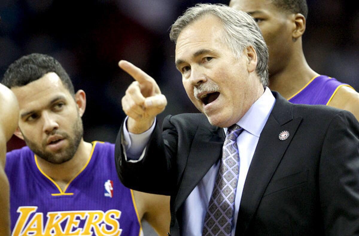 Lakers Coach Mike D'Antoni talks to point guard Jordan Farmar in the first half of game against the Pelicans earlier this month in New Orleans.