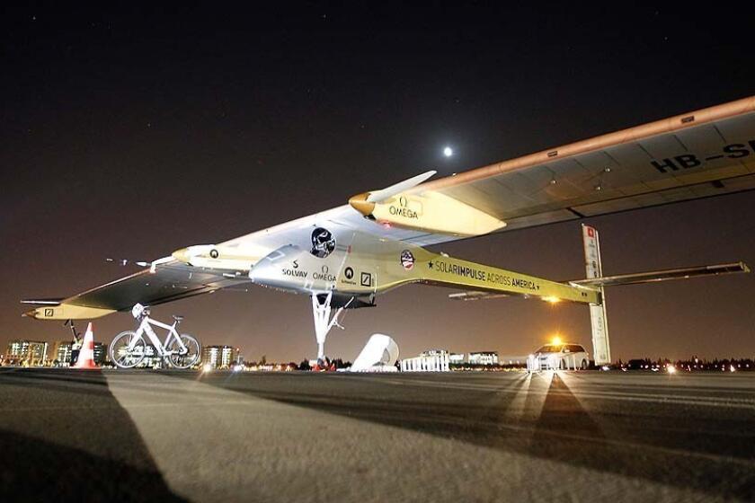 The Solar Impulse sits on the tarmac before takeoff from Moffett Field at NASA Ames Research Center in Mountain View, Calif.