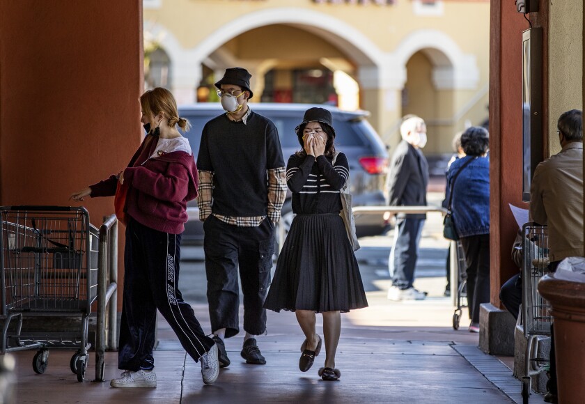 Shoppers in San Gabriel wear masks, amid worry about the coronavirus.