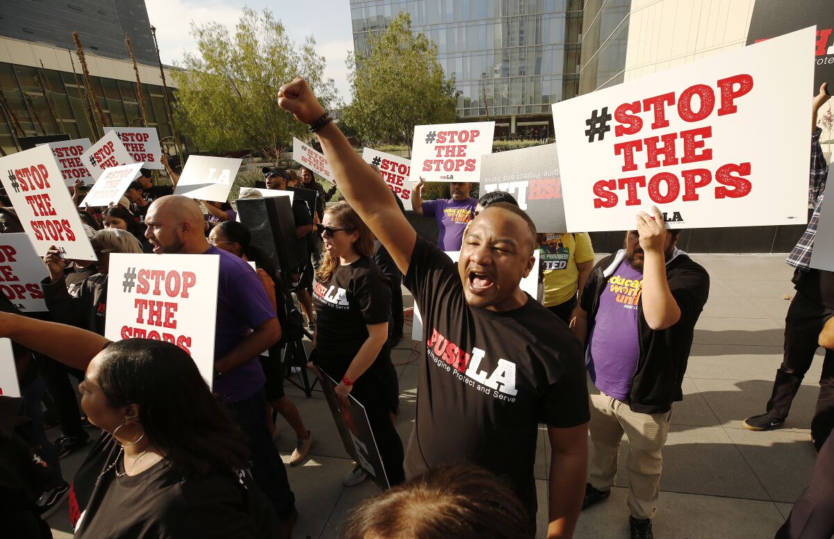 Community groups in front of LAPD headquarters demanding that the department reform its vehicle stop practices, which disproportionately impact blacks and Latinos.