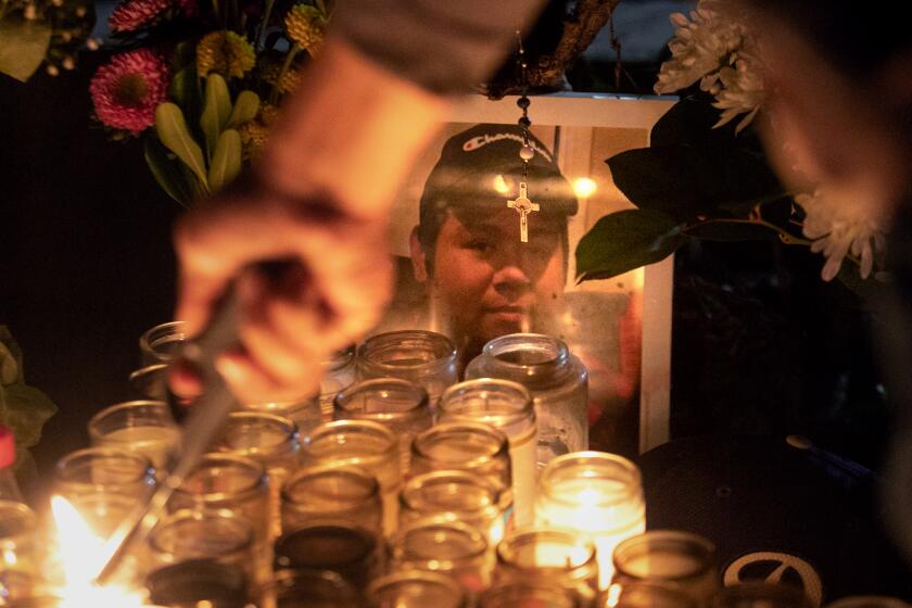 LOS ANGELES, CA - MARCH 08: Daniel Chavarin attends to the memorial set up for his son Xavier who was killed by King Torta in El Sereno on Wednesday, March 8, 2023 in Los Angeles, CA. (Jason Armond / Los Angeles Times)