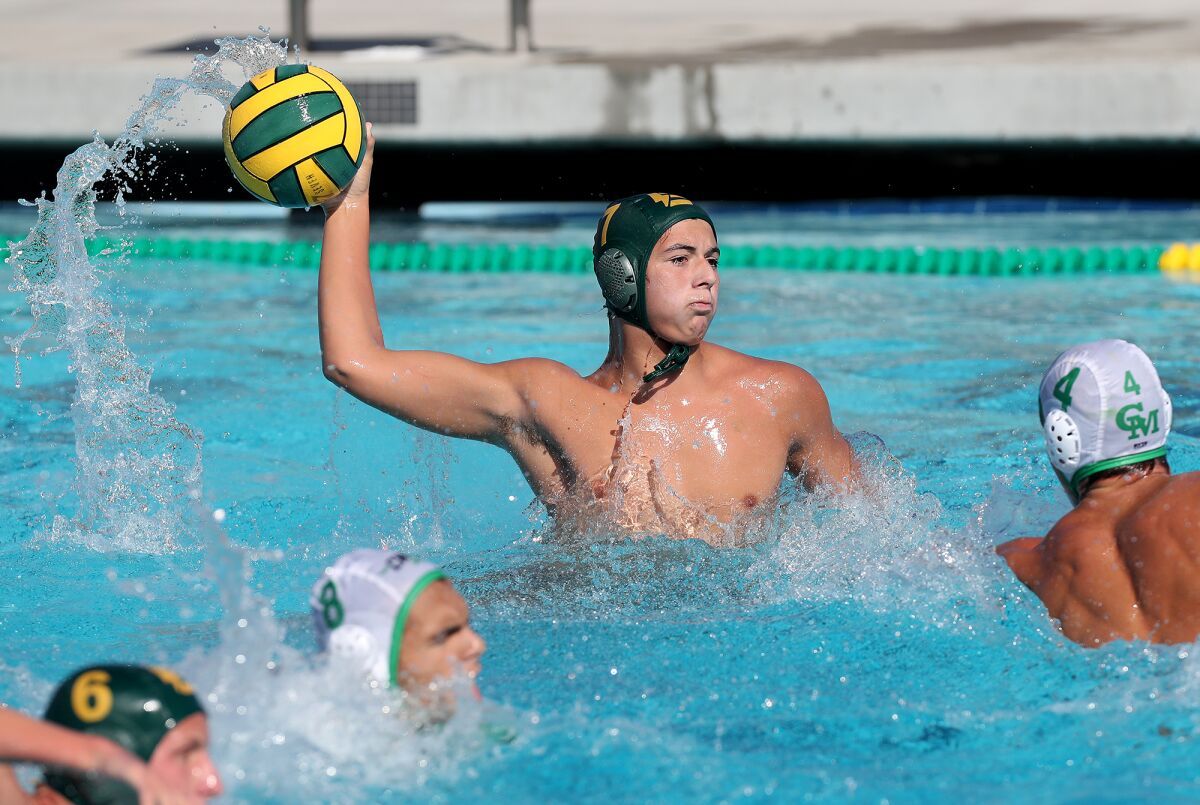 Edison's Josh Winn competes against Costa Mesa in a nonleague boys' water polo game in Huntington Beach on Tuesday.