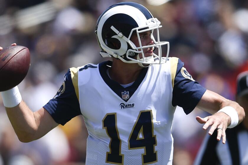 Los Angeles Rams quarterback Sean Mannion passes against the Oakland Raiders during the first half in an NFL preseason football game Saturday, Aug. 18, 2018, in Los Angeles. (AP Photo/Kelvin Kuo)