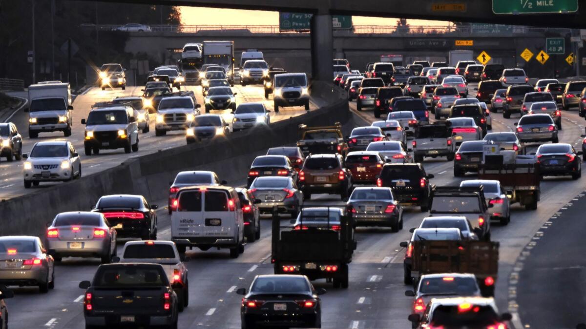 Rush hour traffic makes its way along US 101 near downtown Los Angeles on Nov. 15, 2016.