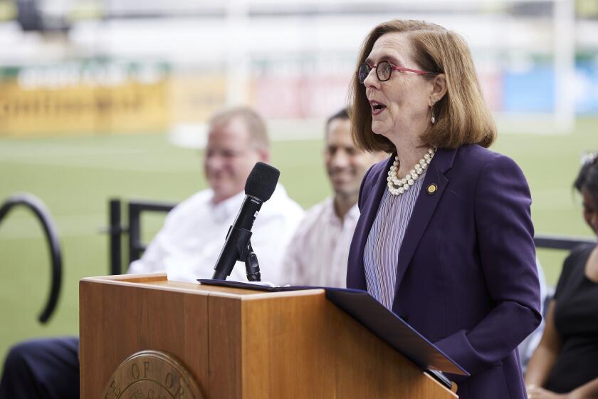 Oregon Governor Kate Brown announces the end of the state's COVID-19 restrictions in Portland, Ore., Wednesday, June 30, 2021. (AP Photo/Craig Mitchelldyer)