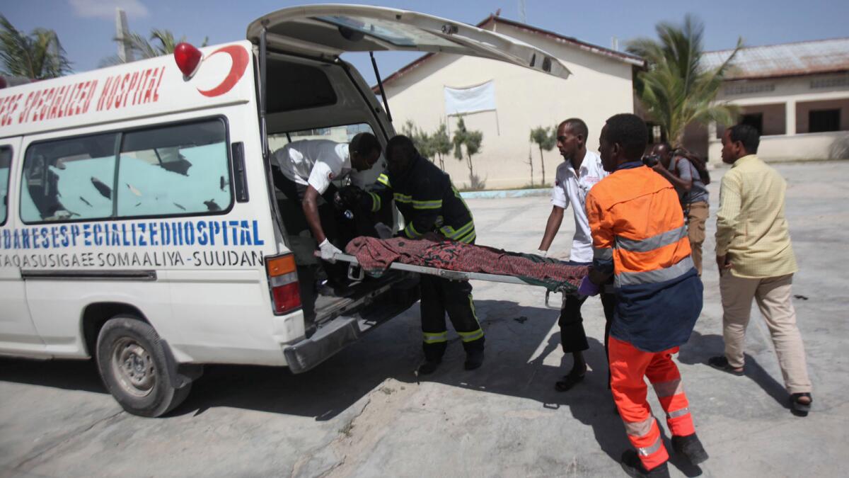A victim is placed in an ambulance after twin explosions in Mogadishu, Somalia.