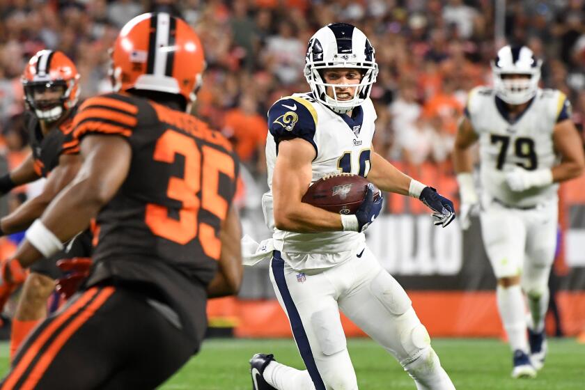CLEVELAND, OHIO SEPTEMBER 22, 2019-Rams receiver Cooper Kupp picks up yards againt the Browns defense at First Energy Stadium in Cleveland Sunday. (Wally Skalij/Los Angeles Times)