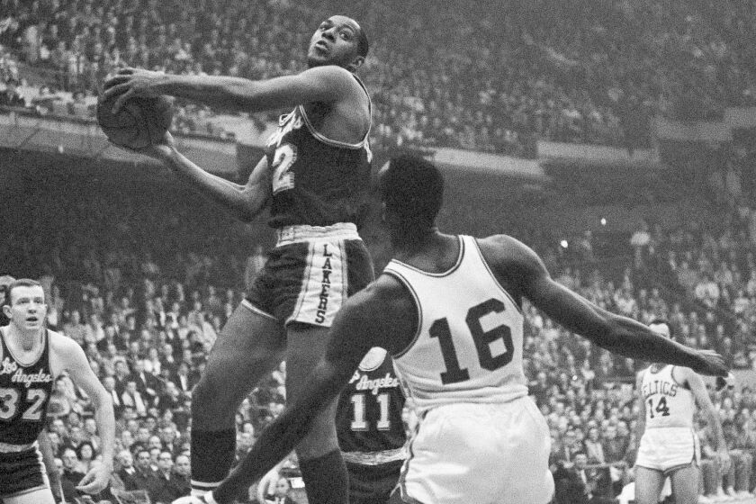 Lakers' Elgin Baylor drives against the Boston Celtics during the NBA championship game in Boston ib April 19, 1962.
