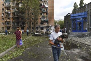 Residents of an apartment building damaged after shelling by the Ukrainian side leave the area in Kursk, Russia, Sunday, Aug. 11, 2024. (AP Photo)