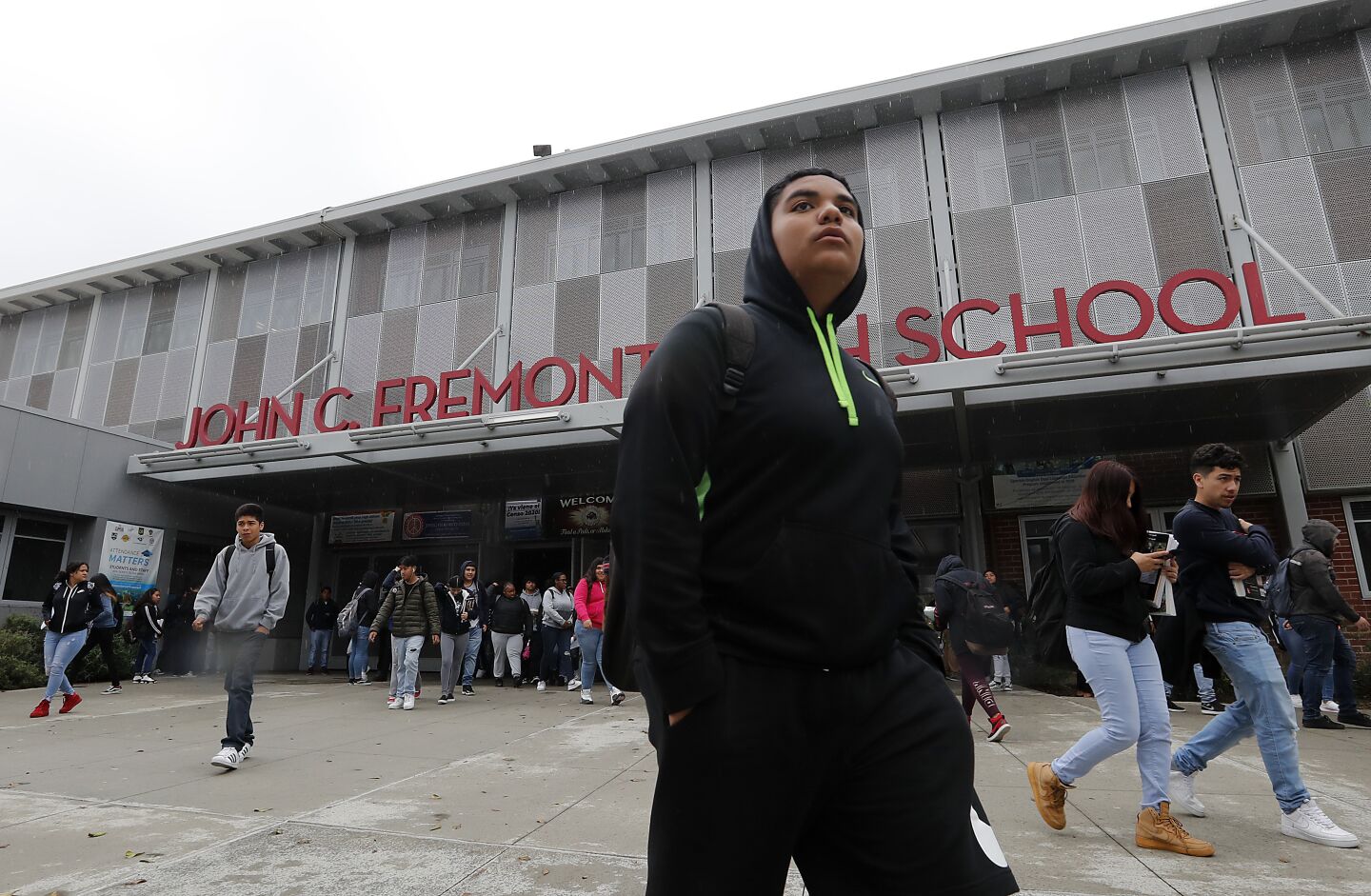 Students leave John C. Fremont High School in Los Angeles at the end of the school day on Friday, Mar. 13, 2020. LAUSD announced it will shut down beginning Monday.