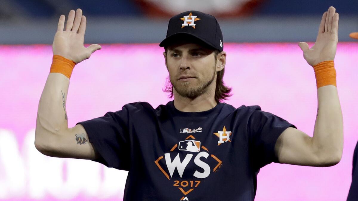 Astros right fielder Josh Reddick warms up before Game 1.