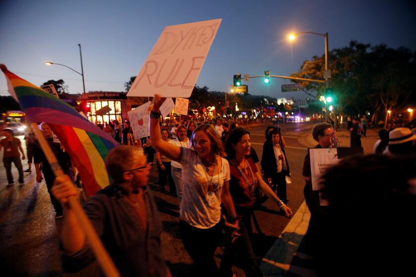 People participate in The Annual WeHo Dyke March on Santa Monica Boulevard in West Hollywood in 2012. Until protests grew loud enough this year, free LA Pride events aimed at lesbians and transgender people were shortened.