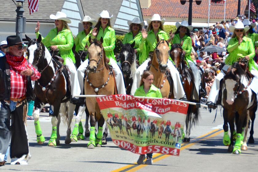 Parade chairman, Jack Callahan rounded up the Norco Cowgirls Equestrian Rodeo Drill Team during the Annual Balboa Island Parade, Sunday.