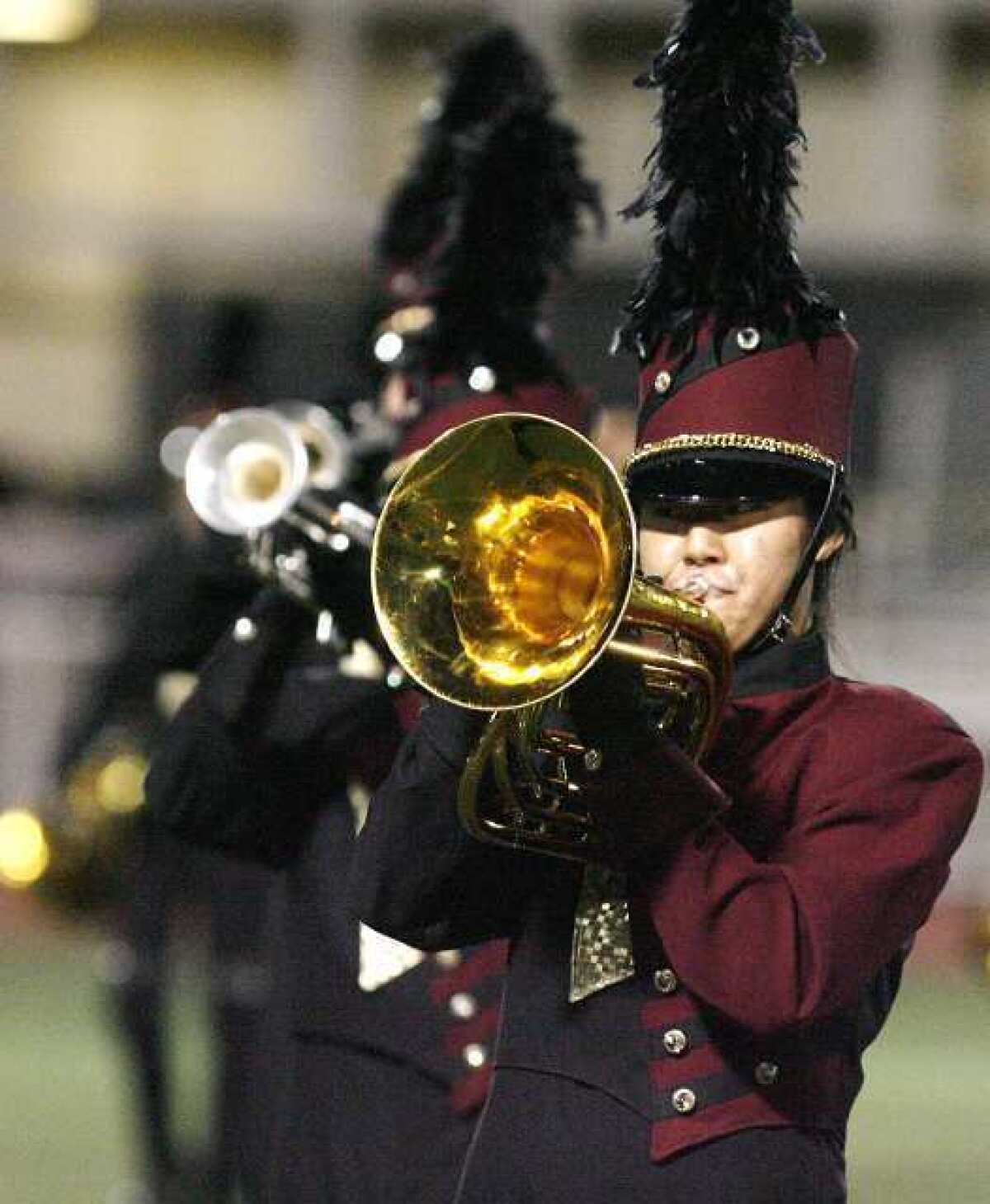 The La Canada High School marching band performs a song from their show entitled "Mechanize" for parents at the high school on Friday. After the brief performance at the school, the band traveled to Clovis to compete in the WBA Championships for the weekend.