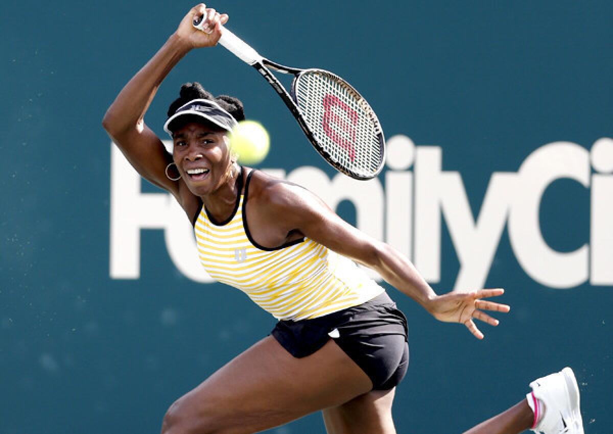Venus Williams chases down a forehard return against Chanelle Scheepers during their match Wednesday in the Family Circle Cup tennis tournament.