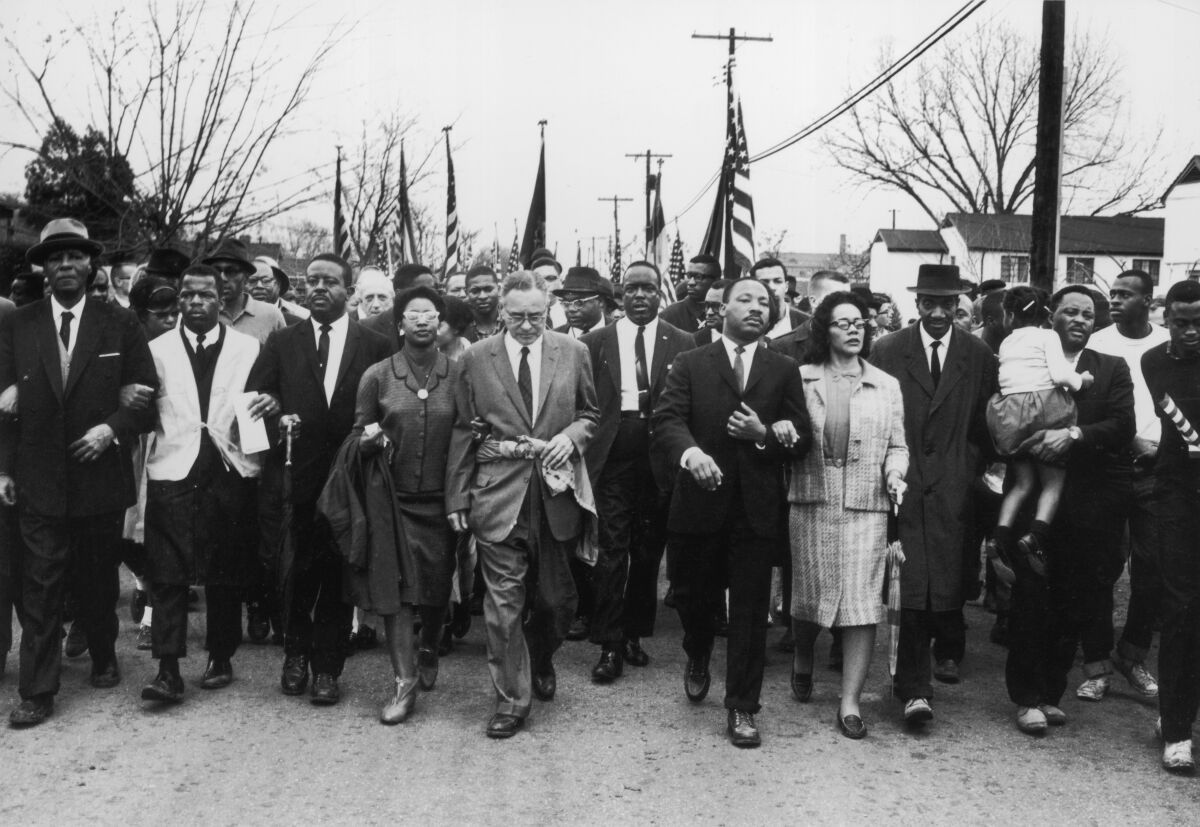 John Lewis, second from left, march from Selma, Ala., to Montgomery in 1965 with leaders including Martin Luther King Jr.