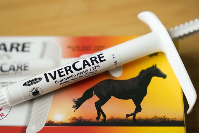 FILE - A syringe of of ivermectin — a drug used to kill worms and other parasites — intended for use in horses only, rests on its box in Olympia, Wash., on Sept. 10, 2021. Wisconsin's conservative-controlled Supreme Court ruled Tuesday, May 2, 2023, that a hospital could not be forced to give the deworming drug to a patient with COVID-19. (AP Photo/Ted S. Warren, File)