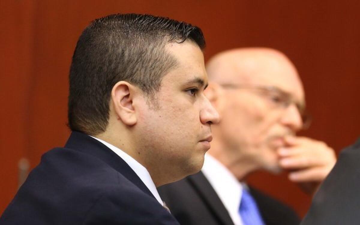 George Zimmerman, left, and defense attorney Don West listen to the questioning of prospective jurors in Seminole circuit court for his trial in Sanford, Fla.