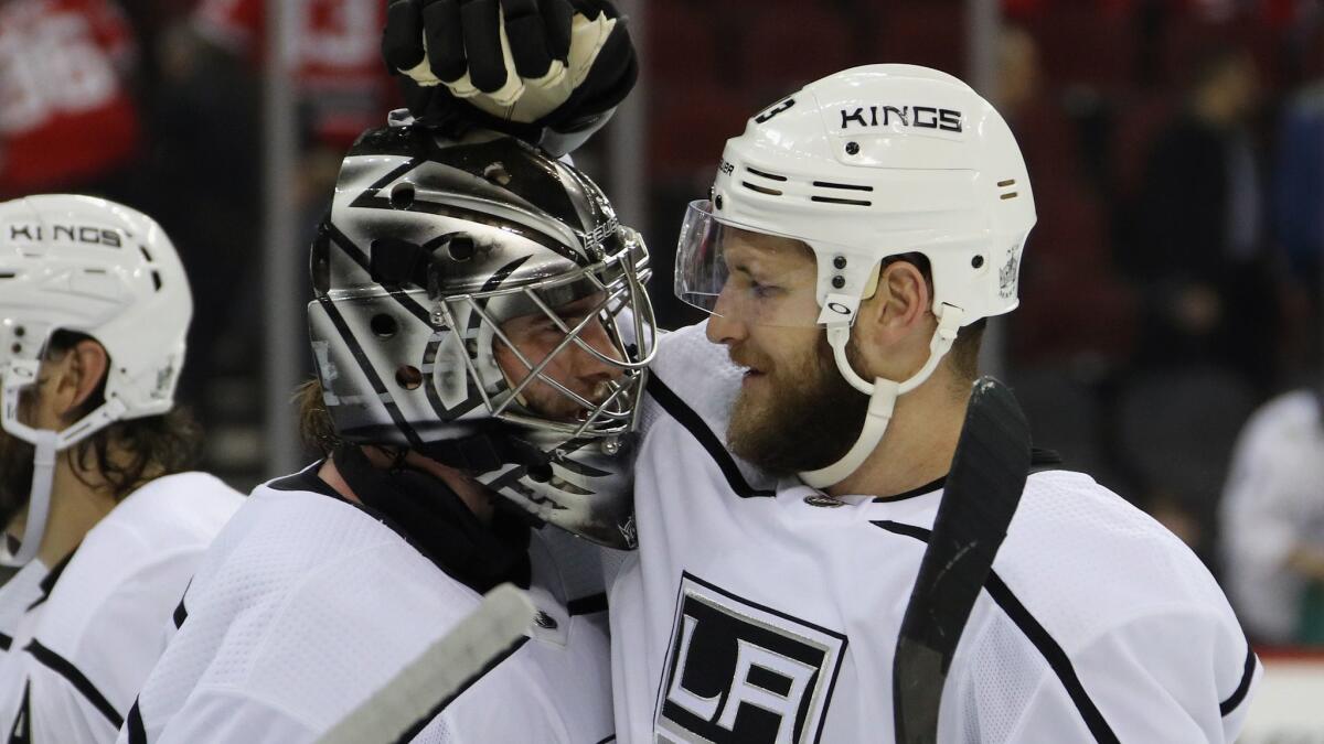 Kings goalie Jack Campbell and Kyle Clifford celebrate a 5-1 victory over the New Jersey Devils on Tuesday.